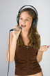 Young pretty girl singing.