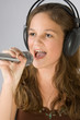 Young pretty girl singing.
