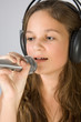 Young pretty girl singing.
