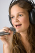 Young pretty girl singing.