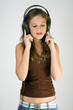 Young pretty girl listen music and singing.