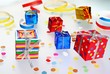 Colorful gifts with shining ribbons on white background