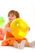 happy girl playing with colorful balloons