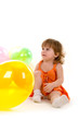 happy girl playing with colorful balloons