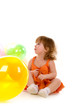 happy girl playing with colorful balloons
