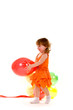 happy girl playing with colorful balloons