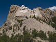 Mount Rushmore with a deep polarized sky.