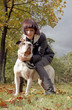 Young woman and strong dog
