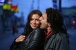 Young loving couple in a city. Biting a chick. Young loving couple in a city. Biting a chick.