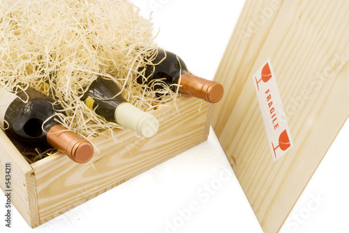 Photo: wooden box with three bottles of wine wooden box with three bottles of wine