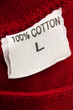 Photo: a t-shirt tag with 100% cotton writen on it a t-shirt tag with 100% cotton writen on it