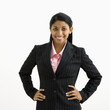 Portrait of smiling businesswoman against white background.