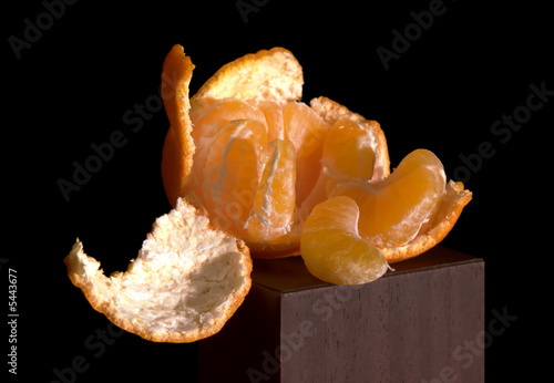 Cleared mandarine on a black background.