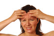 Woman with splitting headache rubbing forehead for relief
