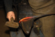 Wrought Iron and Anvil - A worked iron rod ontop of an anvil. Wrought Iron and Anvil - A worked iron rod ontop of an anvil.