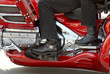 The side view of two motorcyclists on a motorcycle 