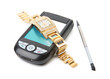 Smartphone and gold watch. Isolate on white.