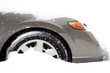 a car's front part buried in snow after a blizzard