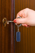 Hand and retro key with empty label