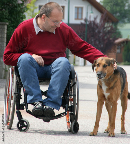 Man in a wheelchair with a dog