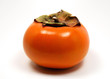 a single whole fuyu persimmon, isolated on white.