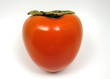single organic hachiya persimmon isolated on white.