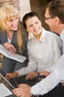 Portrait of two women looking at their boss in the office