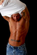 A sexy muscular man removing his shirt