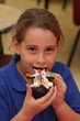 Little girl eating a holiday cookie