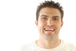 Attractive, casual young man laughing heartily