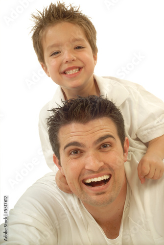 Photo: Young father and his toddler son playing around and laughing Young father and his toddler son playing around and laughing