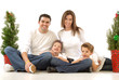 Happy young family posing for their cheerful holiday portrait