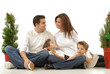 Happy, festive holiday portrait of a young attractive family