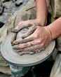 Hands shaping clay on potter's wheel Hands shaping clay on potter's wheel