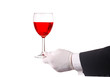 Waiter in Tuxedo Holding a Glass of Red Wine isolated over white