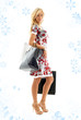 lovely blond with shopping bags with snowflakes