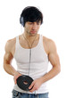A young man in a t-shirt listening to old 45 rpm records