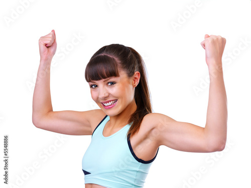 Photo: Isolated fitness girl flexing Isolated fitness girl flexing