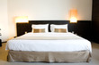 Image of a comfortable looking hotel bed.