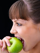 Girl taking a bite of an apple. Girl taking a bite of an apple.