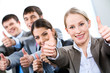 Photo: Portrait of business people giving the thumbs-up sign Portrait of business people giving the thumbs-up sign