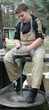 Young boy potter working with clay on wheel