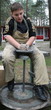 Young boy potter working with clay on wheel Young boy potter working with clay on wheel