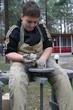 Young boy potter working with clay on wheel Young boy potter working with clay on wheel