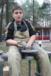 Young boy potter working with clay on wheel Young boy potter working with clay on wheel