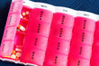 Medical colorful pills in the pink box for daily use
