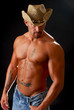 Foto: A muscular man in a cowboy hat A muscular man in a cowboy hat