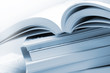 Stack of brochures in blue toned