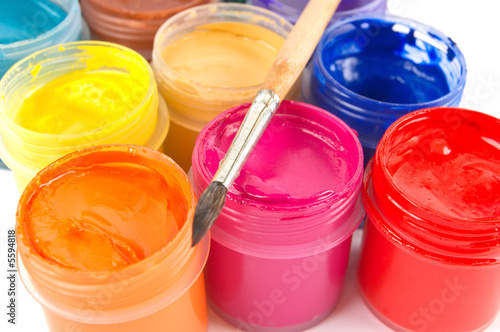 Photo: Multicolored gouache paints and paintbrush Multicolored gouache paints and paintbrush