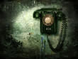 Old phone on the destroyed wall Old phone on the destroyed wall